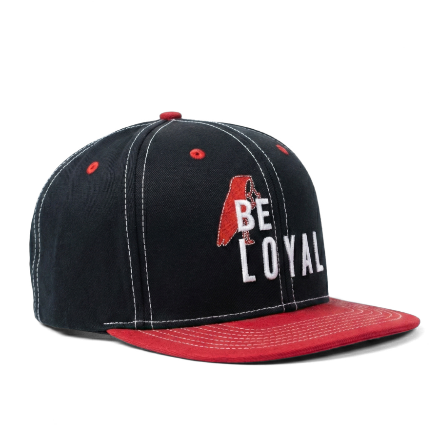 Black and red cap with 'Be Loyal' text on a white background