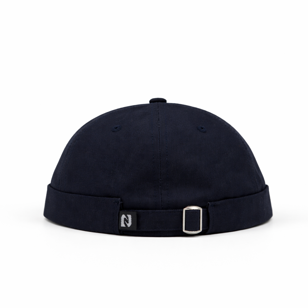 Black cap with a strap on a white background