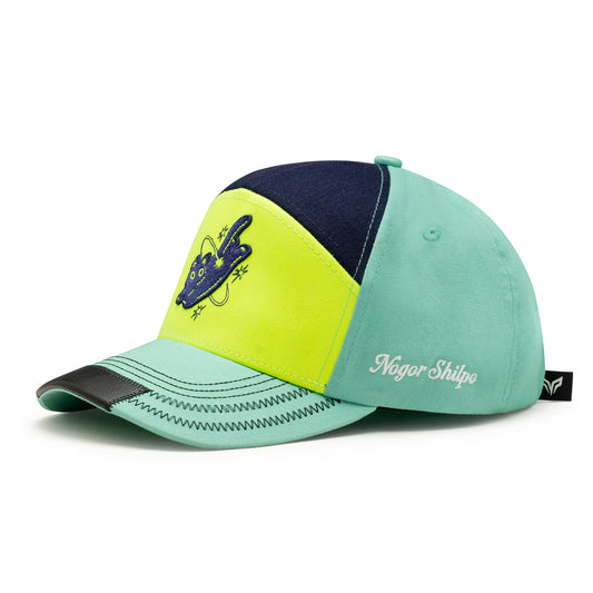 Color-blocked cap with 'Nagar Shilpa' branding on a white background
