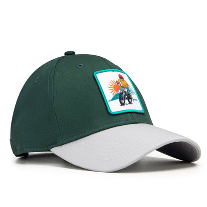 Green and gray cap with a patch on a white background