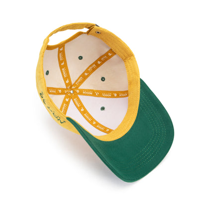 Green and yellow cap with text on a white background