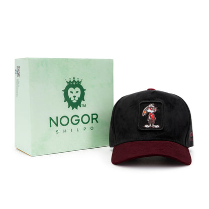 Black and red cap with a patch next to a green box labeled 'Nogor Shilpo' on a white background