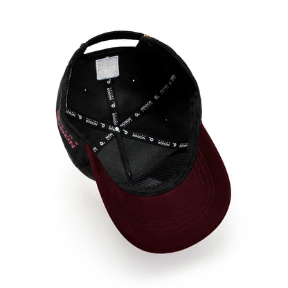 Black and burgundy cap with visible branding on a white background
