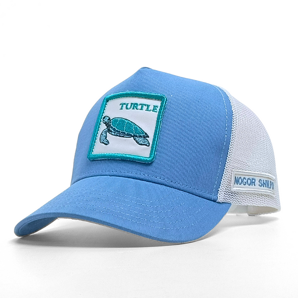 Blue cap with turtle patch and 'Nogor Shiloh' text on a white background