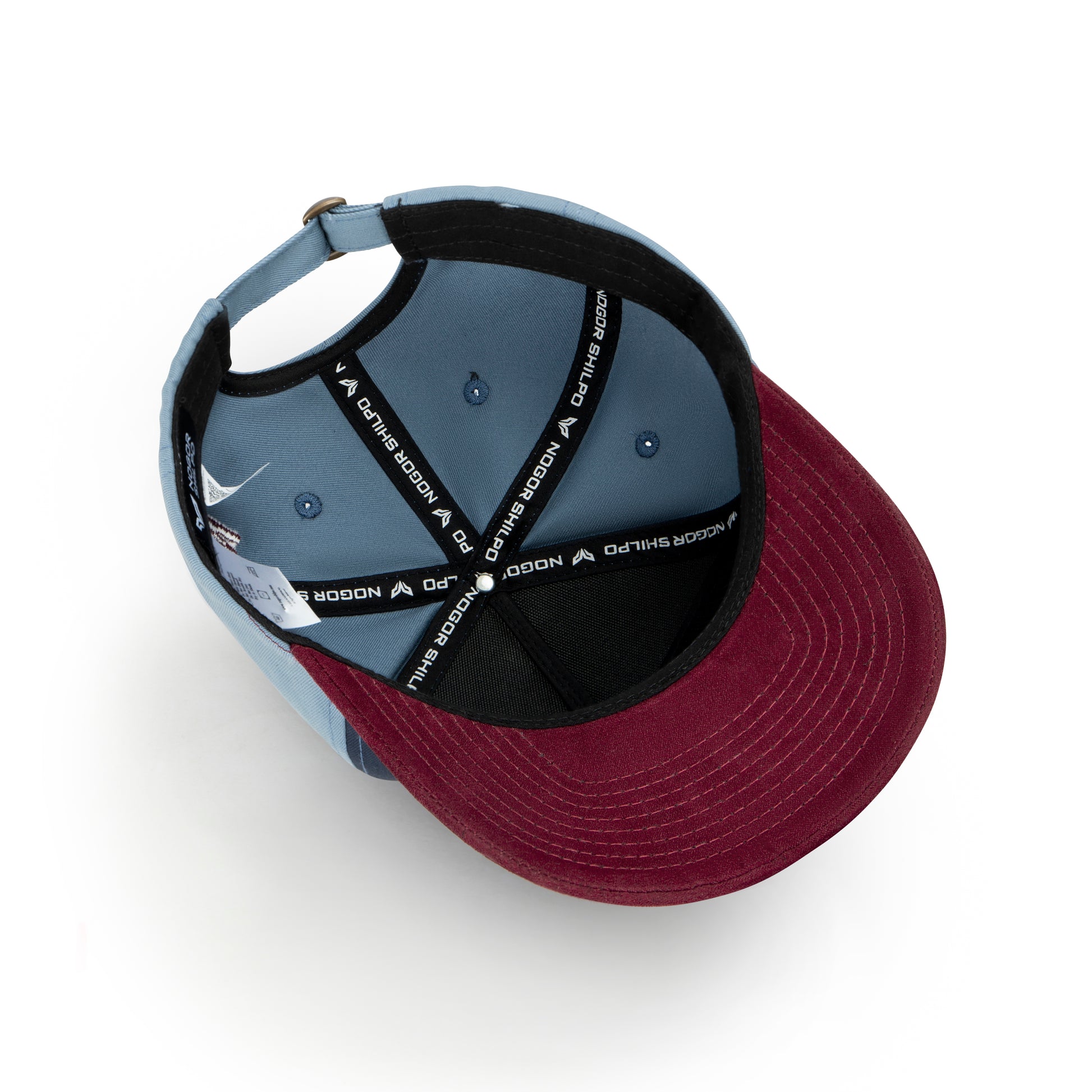 Two baseball caps, one gray and one burgundy, on a white background.