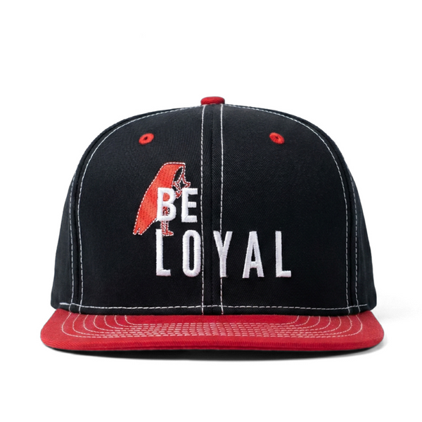 Black and red cap with 'BE LOYAL' text on a white background