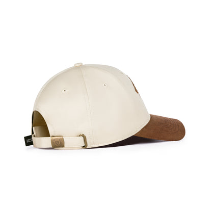 Two-tone cap with beige front and brown back on a white background