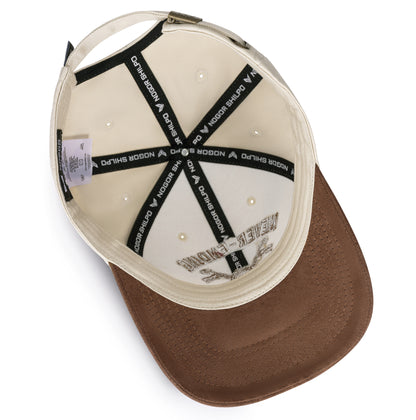 Brown cap with white interior and black text on a white background