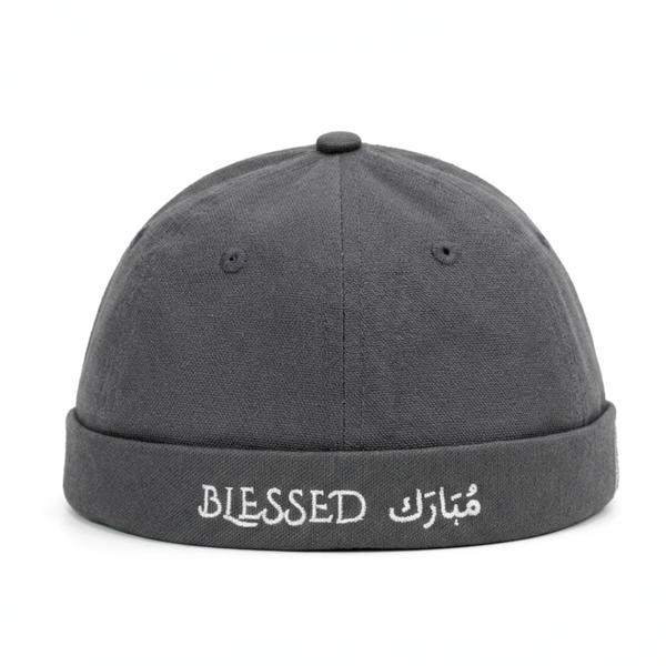 Gray cap with 'BLESSED' text on a white background