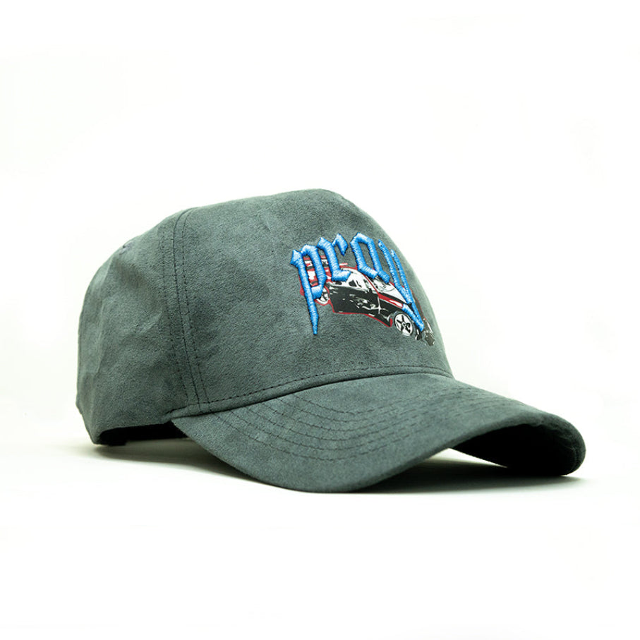 Green cap with embroidered design on a white background