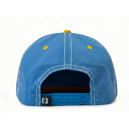 Blue cap with yellow buttons on a white background