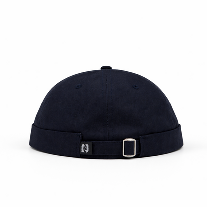 Black cap with a strap on a white background