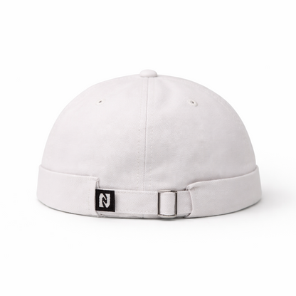 White cap with a small logo on a white background