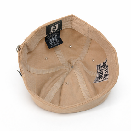 Beige cap with brand label on a white background
