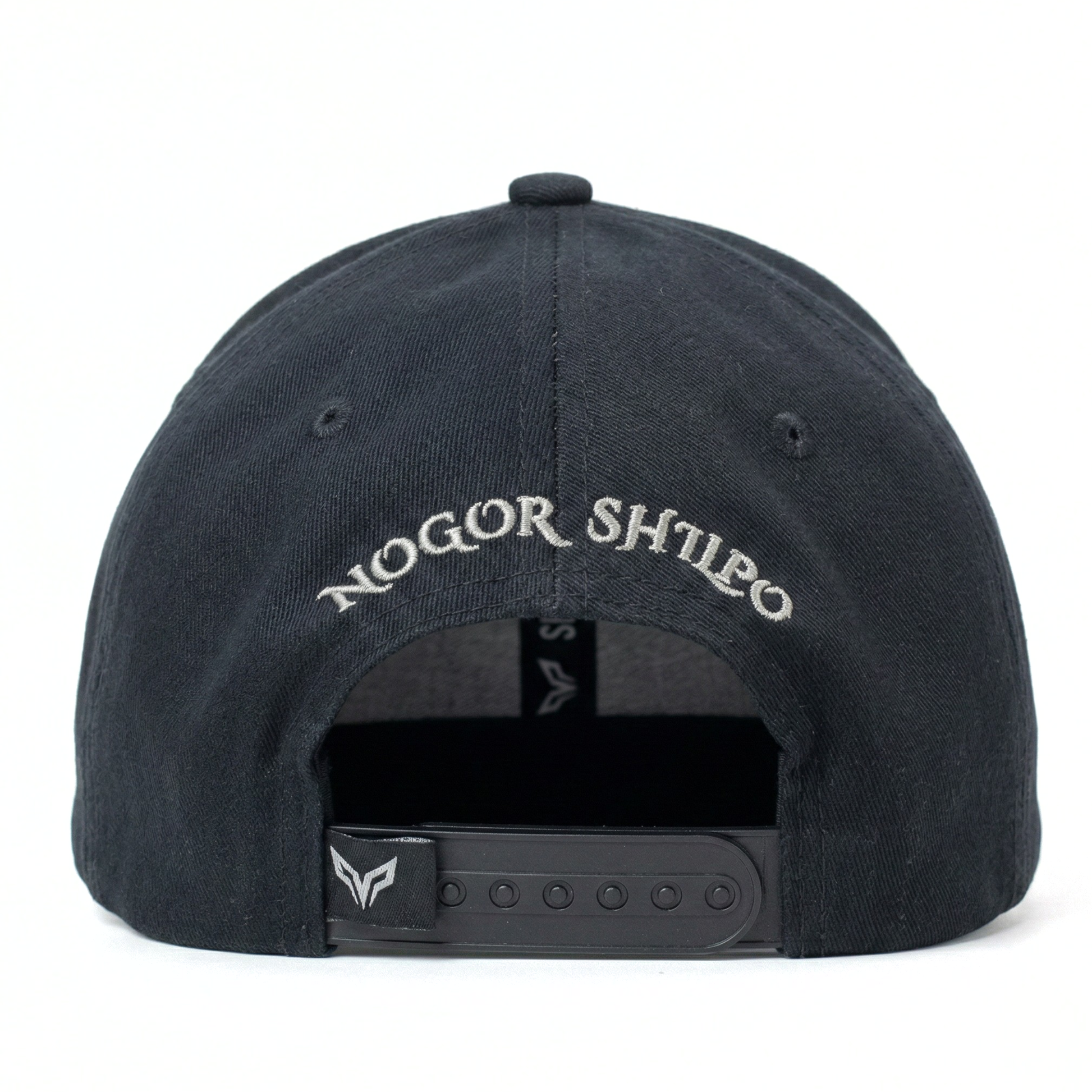 Black cap with 'Nogor Shilo' embroidery on a white background