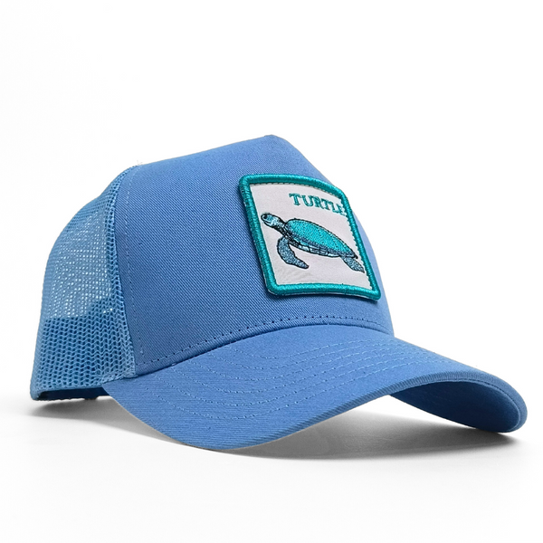 Blue cap with a turtle patch on a white background