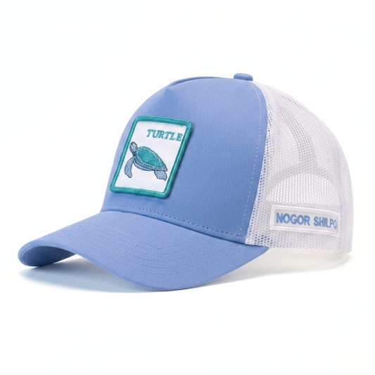 Blue and white cap with turtle patch on a white background