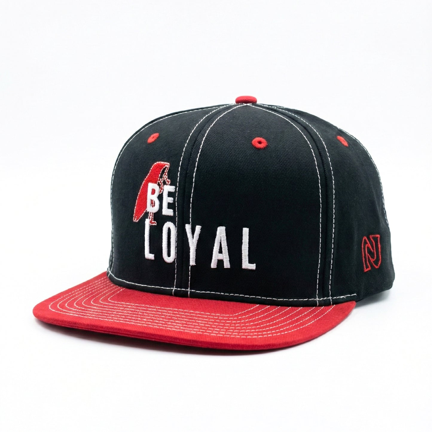 Black and red cap with 'BE LOYAL' text on a white background