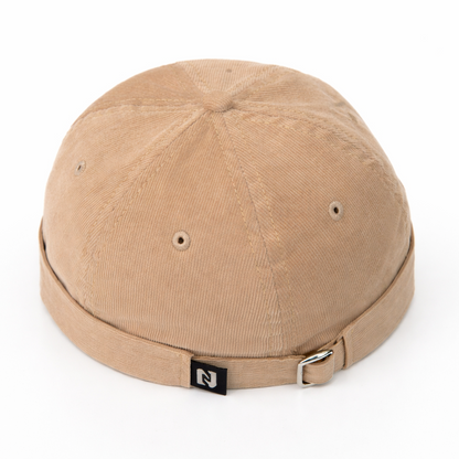 Beige cap with a brand logo on a white background