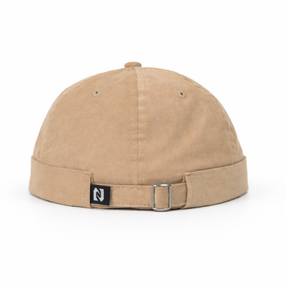 Beige cap with a logo on a white background