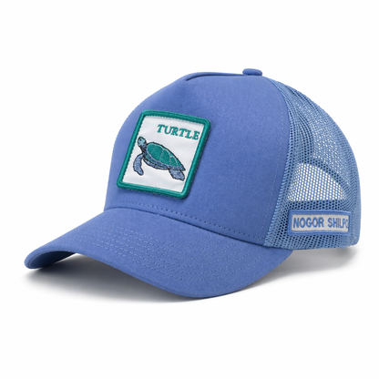Blue cap with turtle patch and 'Nogor Shipyards' branding on a white background