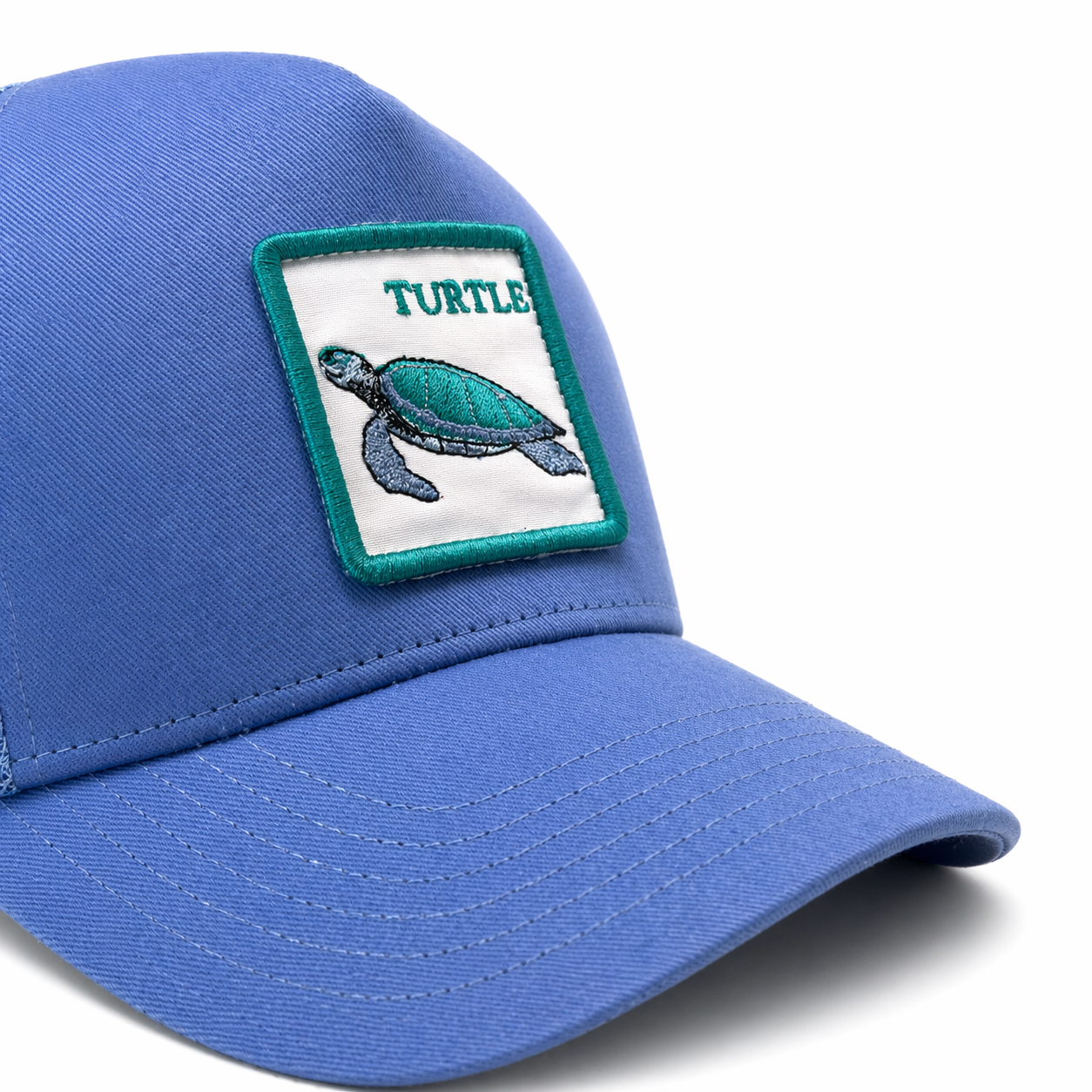 Blue cap with a turtle patch on a white background