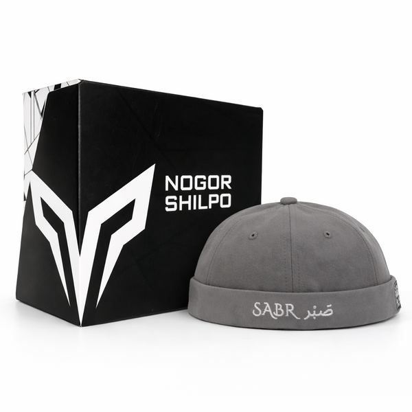 Gray cap with 'SABR' branding next to a black box with 'Nogor Shilpo' branding on a white background