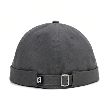 Gray cap with a buckle on a white background
