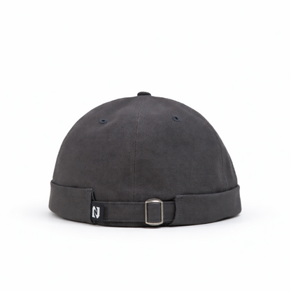Black cap with a strap on a white background