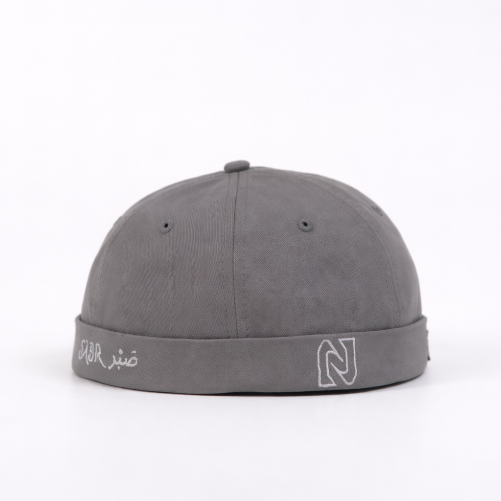 Gray cap with branding on a white background