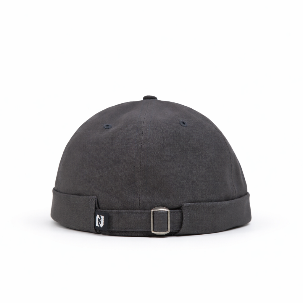 Black cap with a strap on a white background