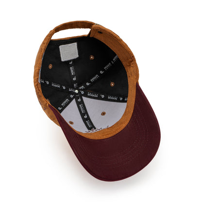Brown cap with a black interior on a white background