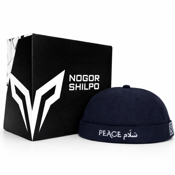 Navy blue cap with 'Peace' text and logo next to a black box with 'Nogor Shilpo' branding on a white background.